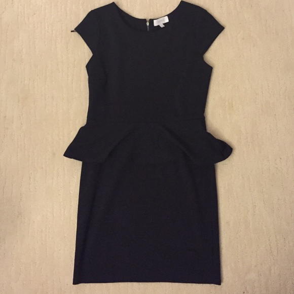 Black cap sleeve dress with peplum detail