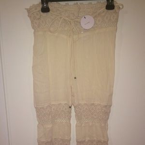 View all photos!  NEVER WORN WITH TAGS FLARED PANT