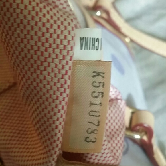 Dooney and bourke bag. Lilac with tan trim. - Picture 2 of 4
