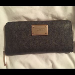 Authentic Michael Kors logo zip around wallet