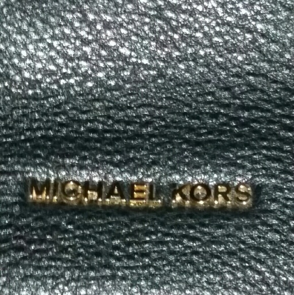 Crossbody Michael Kors purse.