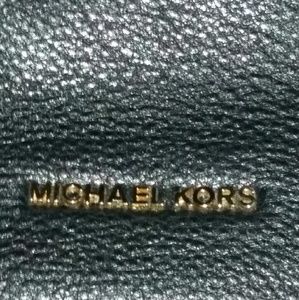 Crossbody Michael Kors purse.