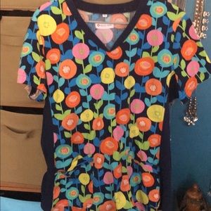 Flowered patterned scrub top.