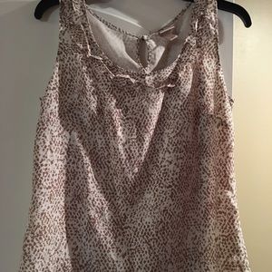 Beautiful shirt. No stains or holes. Dry clean.