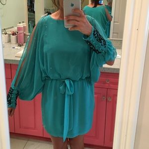 Cocktail dress with sequin sleeves