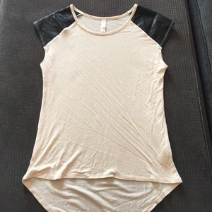 Cream colored shirt with faux leather cap sleeve