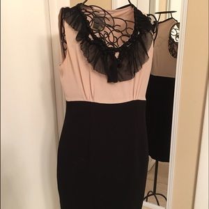 Nude/black dress with delicate black ruffle.