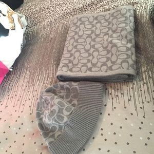 A silver/grey coach scarf and hat.