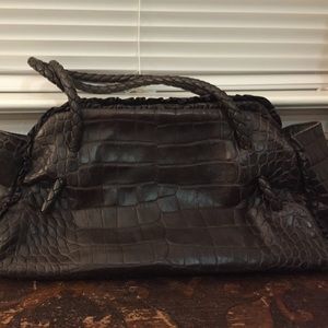 Furla snake looking skin bag with braided handles.