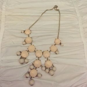 White-cream colored necklace