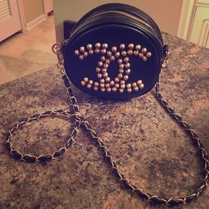 Nonauthentic black leather cross body bag