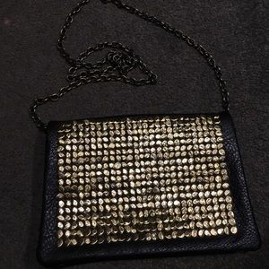 Metal studded cross-body