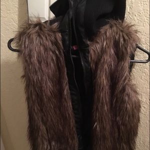 Long neck faux fur vest.