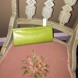 Smart and sexy lime green clutch.
