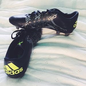 Neon green and black soccer cleats