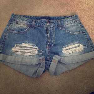 Distressed denim cutoff shorts