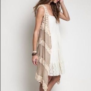 Sleeveless vest with crochet detail. Medium.