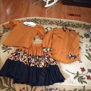 Two sets of skirts and blouses