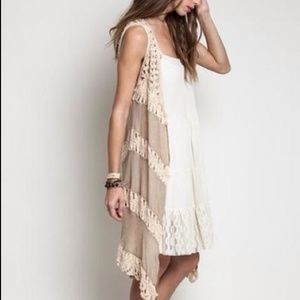 Sleeveless vest with crochet detail. Size Large