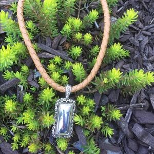 Braided tan leather necklace with pendant