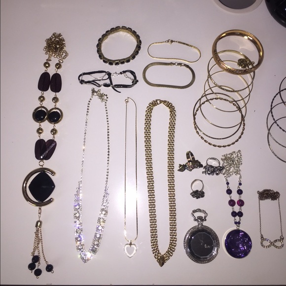 a bundle of silver and gold jewelry