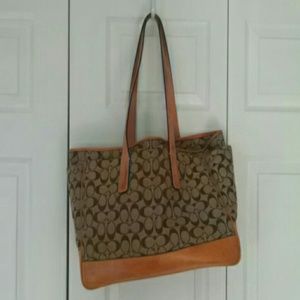 Large tan Coach baby bag