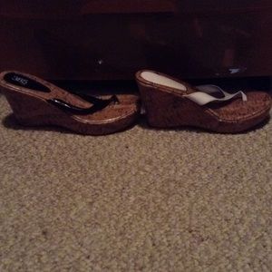 Black and white wedge flip flops