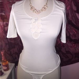 White lace up body suit.