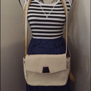 Trifold style cream/bone crossbody bag