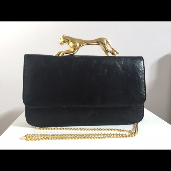 Deena and Oozzy Panther handle handbag
