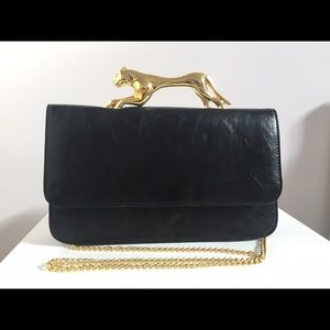 Deena and Oozzy Panther handle handbag