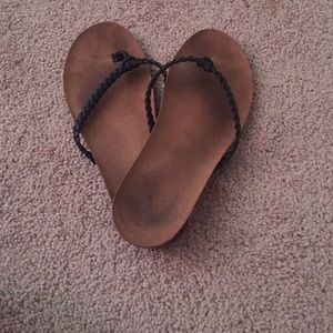 Brown sandals with black leather strap