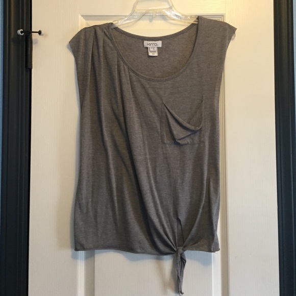 Gray shirt with pocket, and ties at the bottom
