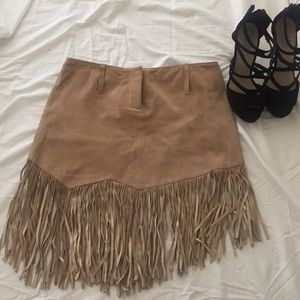 Bebe 100% leather fringe skirt