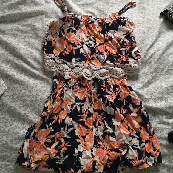 Navy blue, peach, and white floral romper