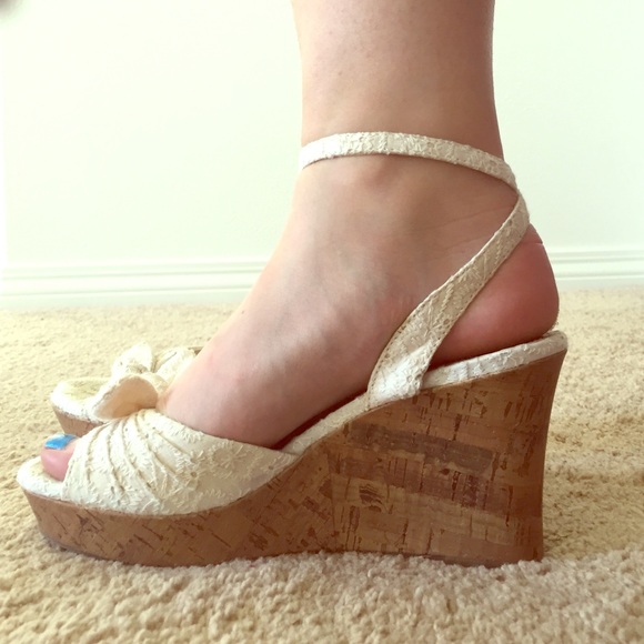 Lace wedges with bows on the toes