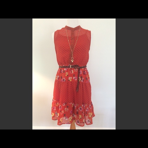 Girly orange floral dress with ruffle bottom.