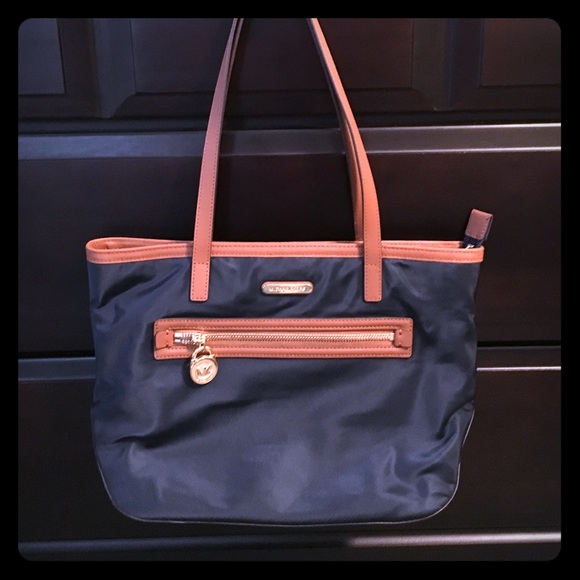 Michael Kors navy with brown seams and gold zipper