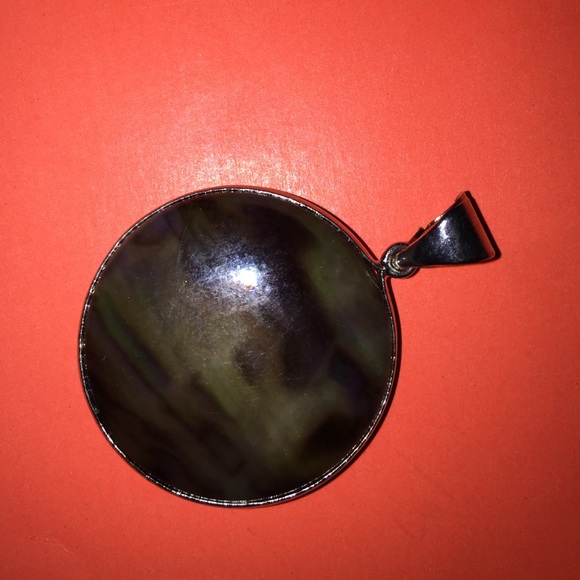 Hand design round dark strip pendant.