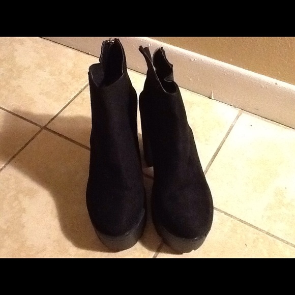 Black chunky heeled boots.