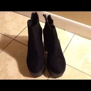 Black chunky heeled boots.