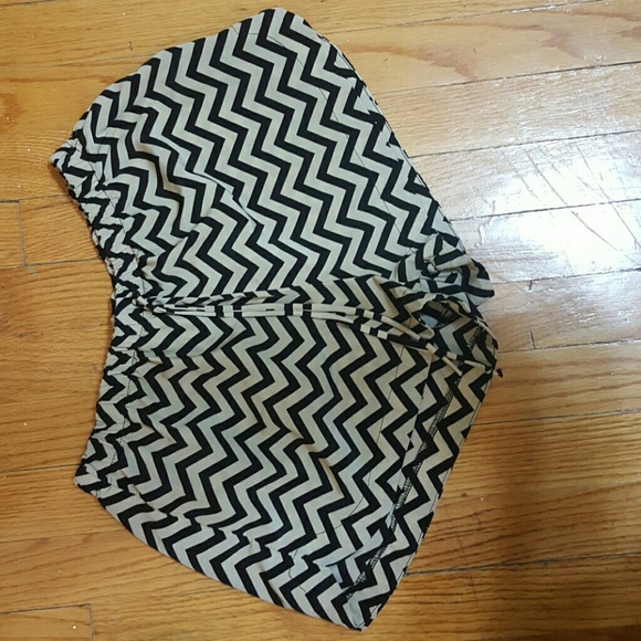 Tan shorts with black zigzag strips