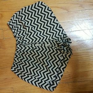 Tan shorts with black zigzag strips