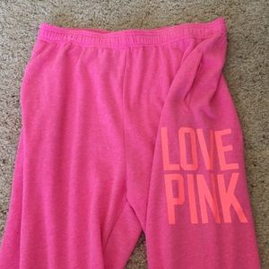 Pink sweats, cuffed at bottom