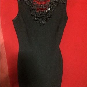Black dress with detail bottom and lace front.