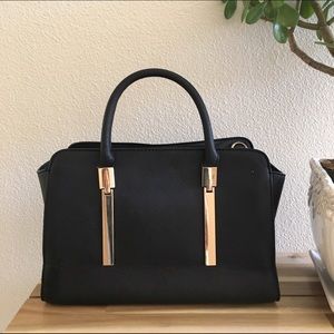 Black purse with gold accents