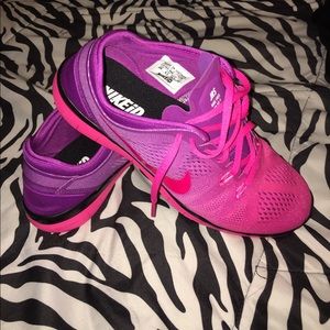 Pink/purple Nike 5.0 free runs.