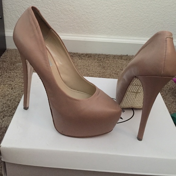 Nude Steven madden heels with embellishment.