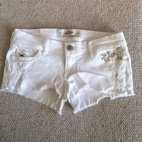 Holey white jean shorts