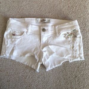 Holey white jean shorts